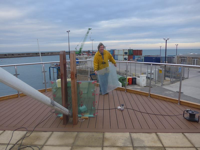 Glass panels are put into place on Alderney SC's Shipshape Deck photo copyright ASC taken at Alderney Sailing Club